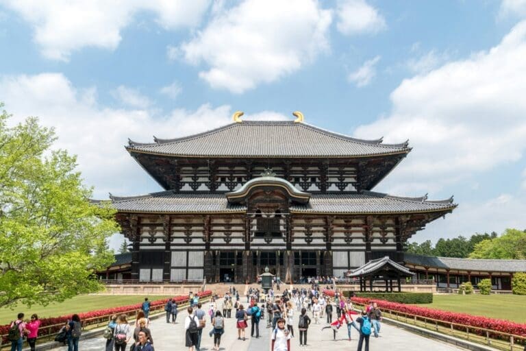 nara-toudaiji-1 Todai-ji Temple in Nara, Japan, featuring traditional architecture with a large wooden structure and a crowd of visitors in front.