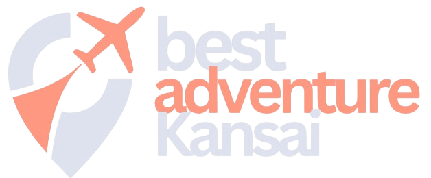 Logo with a map pin and airplane graphic on the left, and the text “best adventure Kansai” in blue and orange on the right.